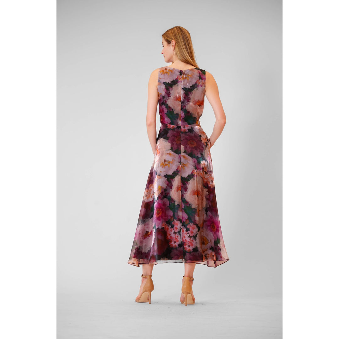 A sleeveless floral organza midi gown with flowing chiffon fabric in shades of pink purple and deep magenta