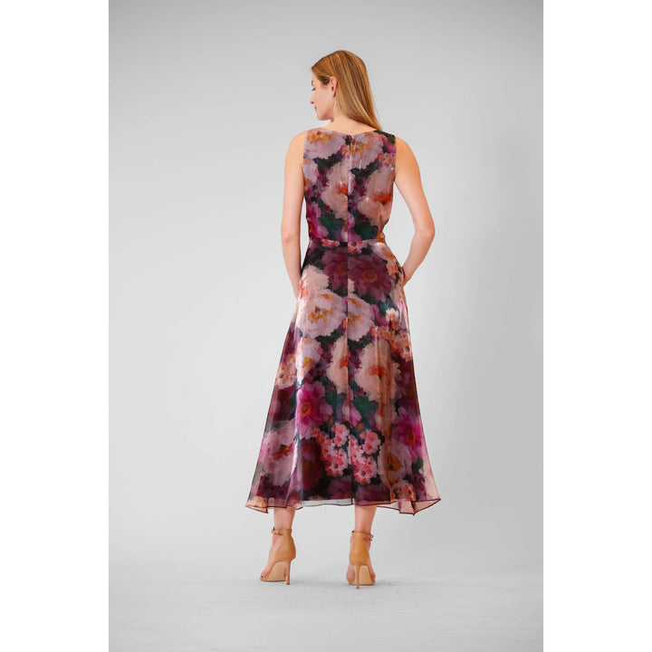A sleeveless floral organza midi gown with flowing chiffon fabric in shades of pink purple and deep magenta