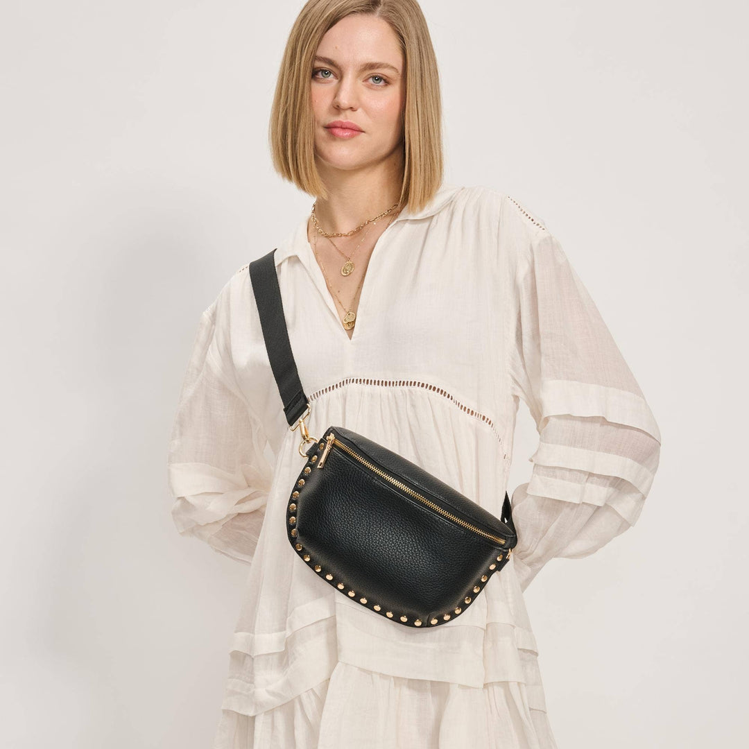 Black leather Gizelle belt bag with gold-tone studs and zipper crossbody design for hands-free use