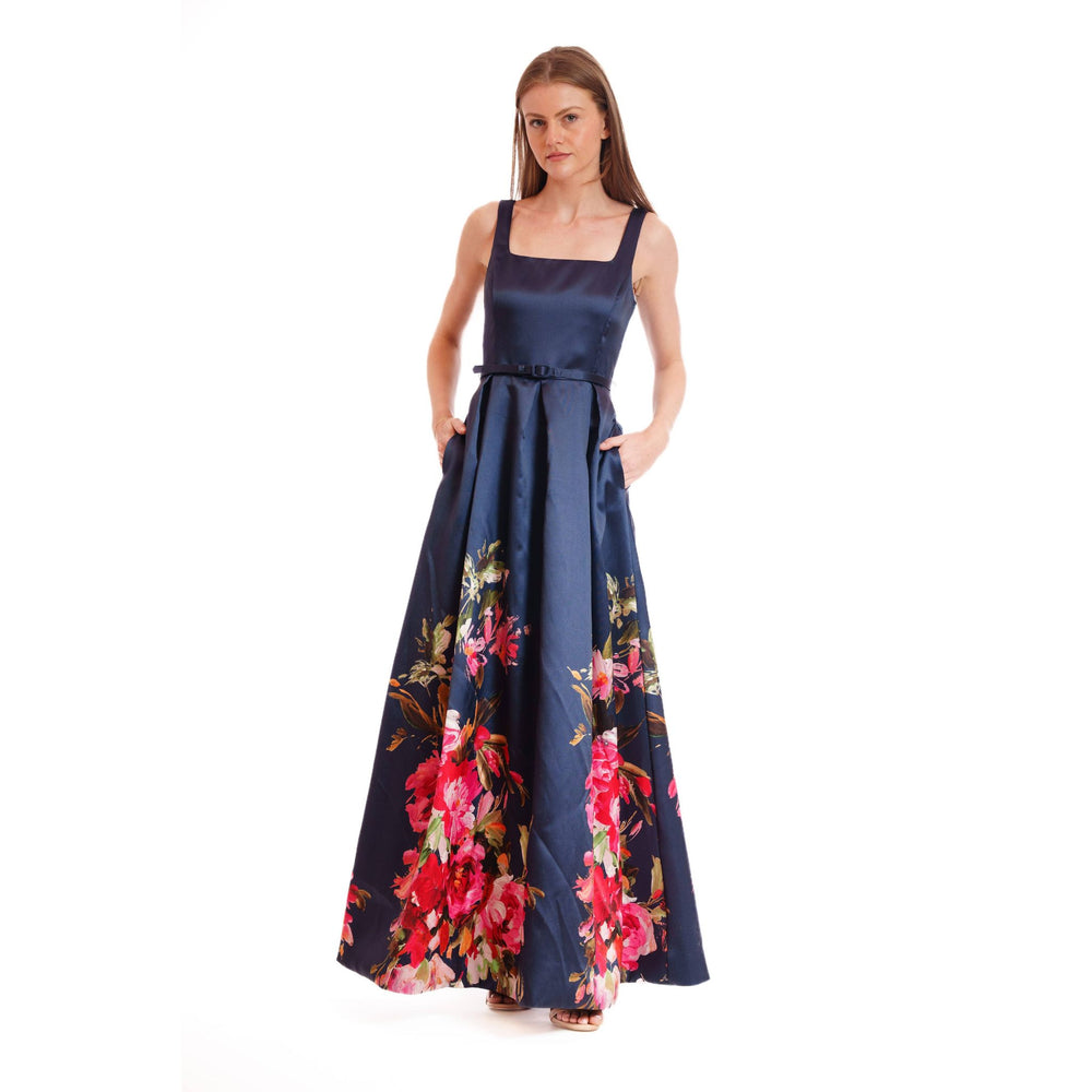 Navy satin evening bloom gown with square neckline fitted bodice and flowing skirt with red and pink floral patterns