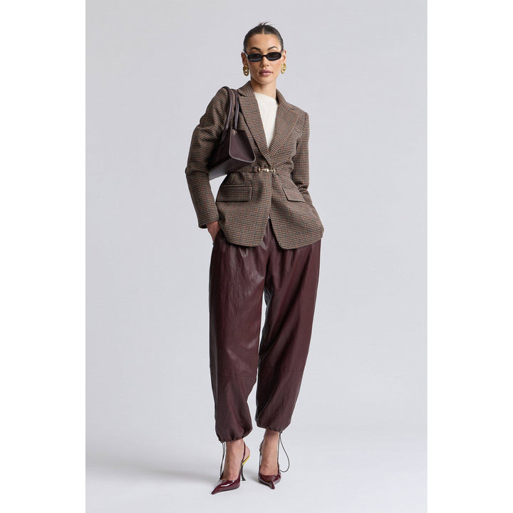 Brown houndstooth belted blazer with structured shoulders made from woven fabric for a polished look