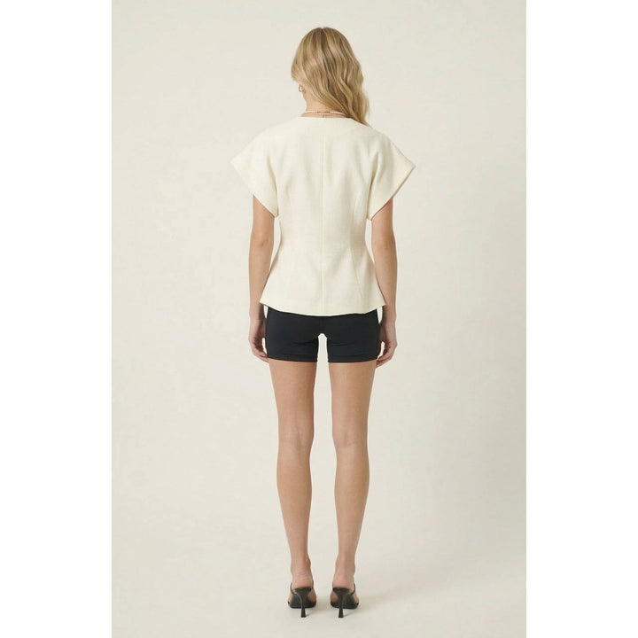 Off-white textured wrap top with short sleeves and peplum hem in relaxed fit for casual wear