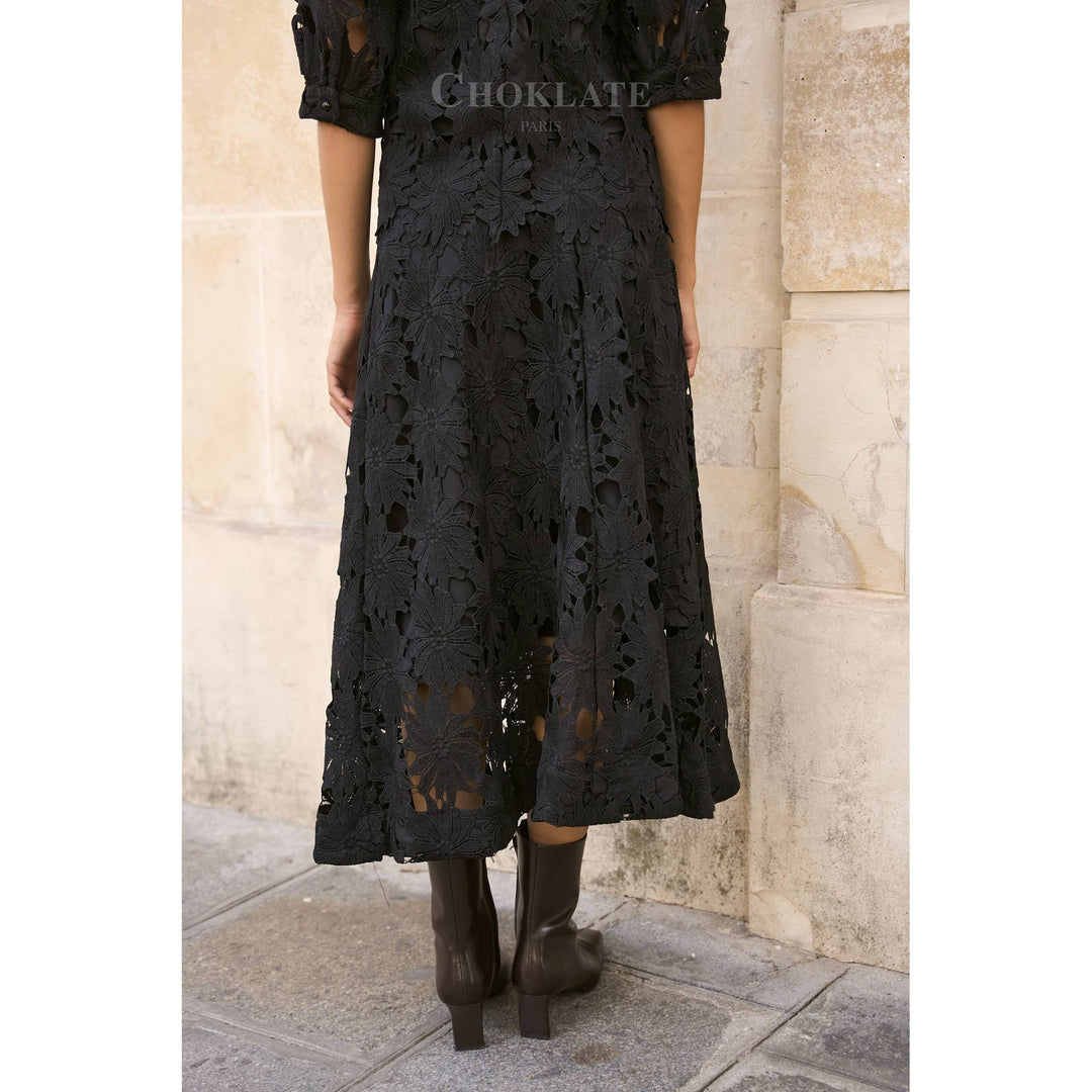 Black lace midi dress with floral cutout pattern and short puffed sleeves in Daisy Guipure skirt style