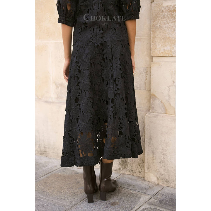 Black lace midi dress with floral cutout pattern and short puffed sleeves in Daisy Guipure skirt style