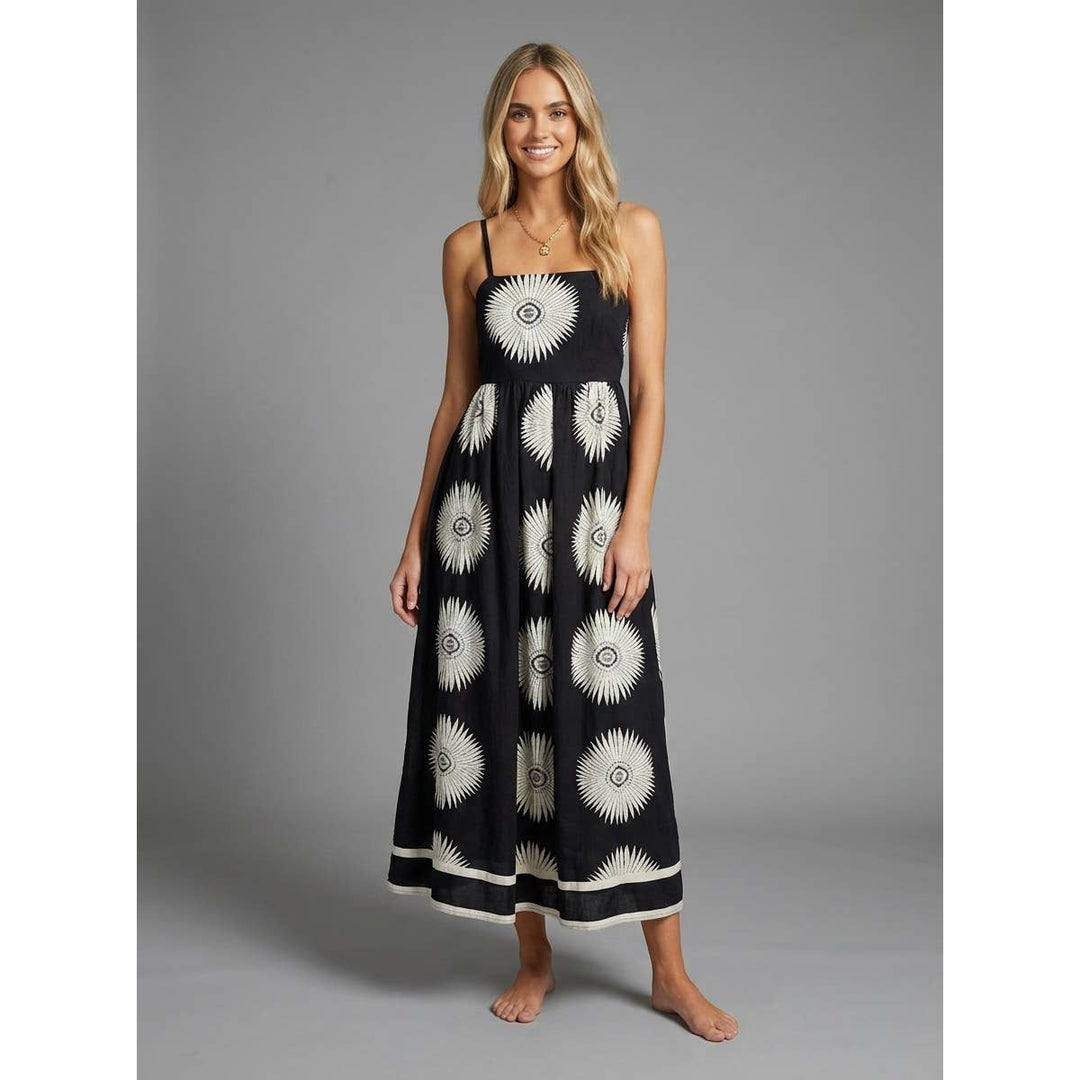 Black cotton lunar bloom maxi dress with white sunburst patterns and matching hemband for casual wear