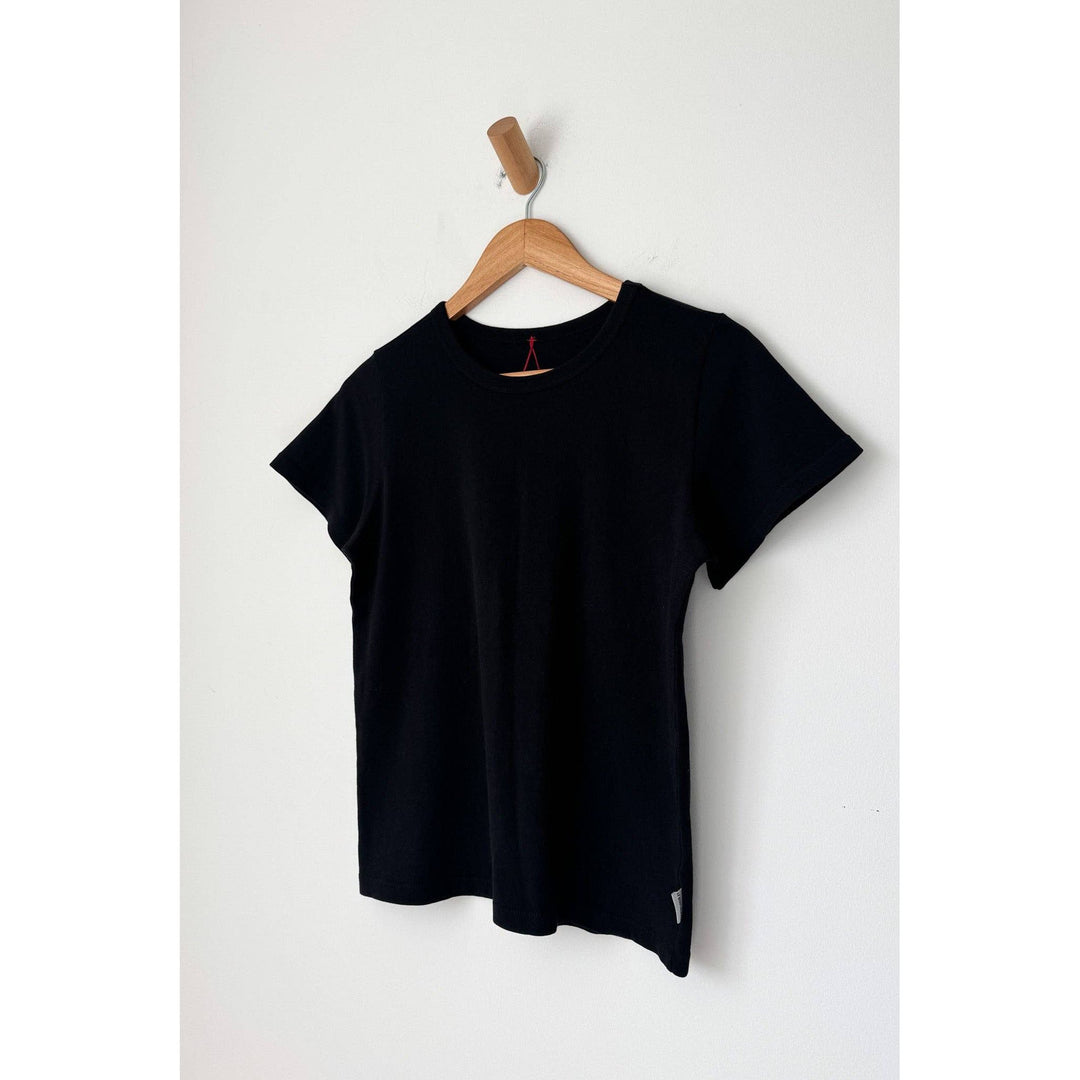 Black short-sleeved cotton premium tee hanging on wooden hanger the go-to premium tee black