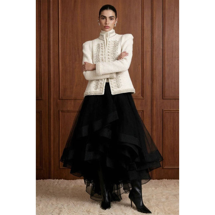 Cream-colored bouclé pearl embellished military jacket with intricate silver embroidery and structured shoulders
