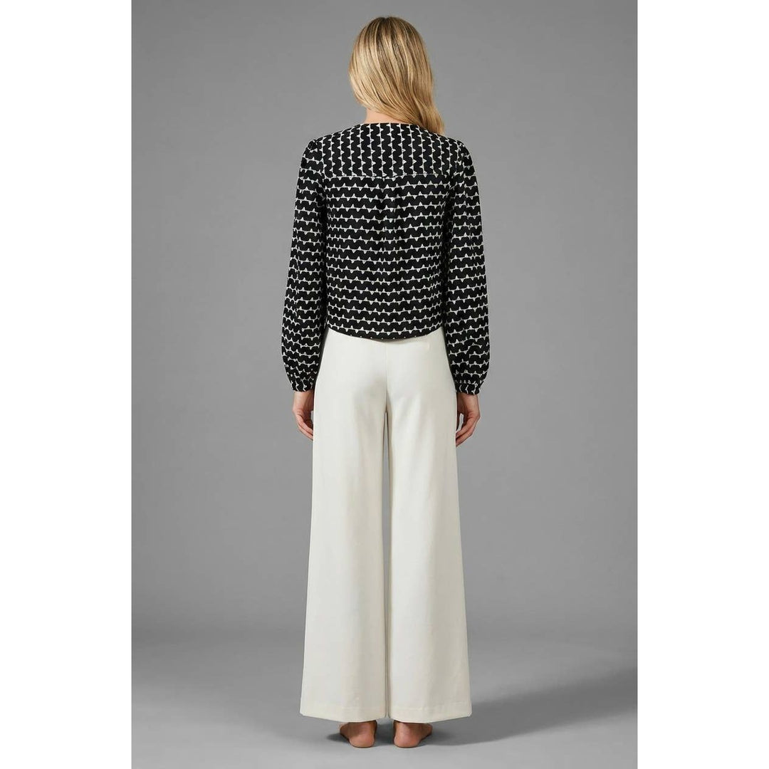 Black and white patterned muse tie-front blouse with long sleeves perfect for stylish casual wear
