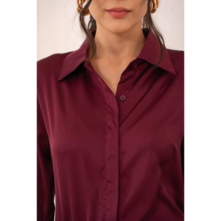 A sleek burgundy satin button-up shirt with classic collar and subtle sheen called Lia Satin Shirt-Bordeaux
