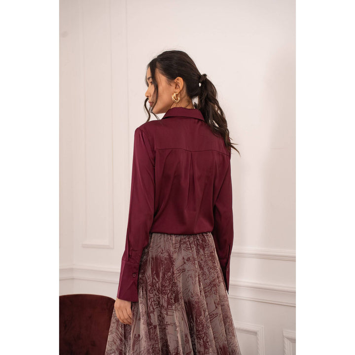 A sleek long-sleeved burgundy satin blouse with subtle sheen and structured collar called Lia satin shirt-bordeaux