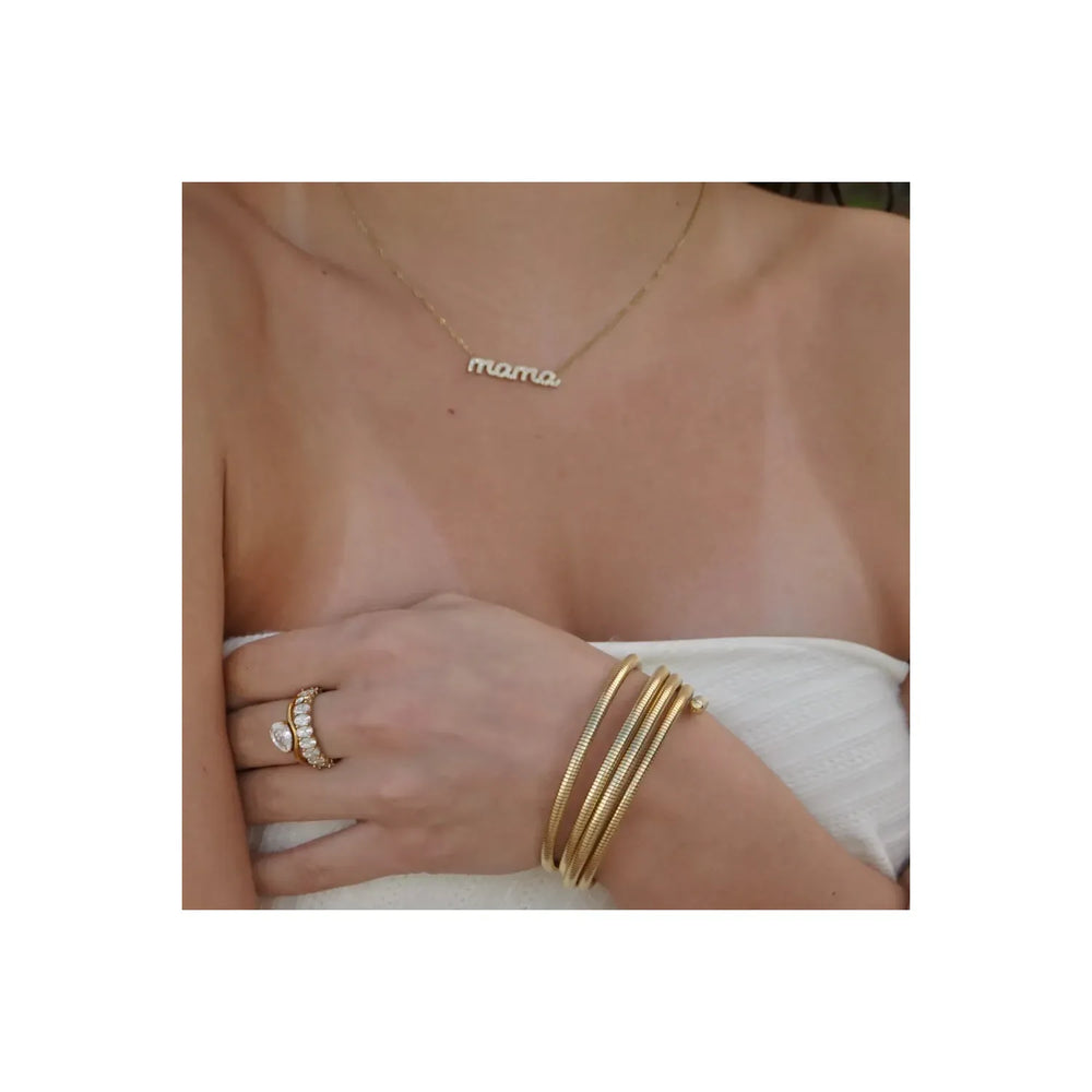 Gold-toned eloise mama pendant necklace with delicate chain and sparkling lettering for stylish everyday wear