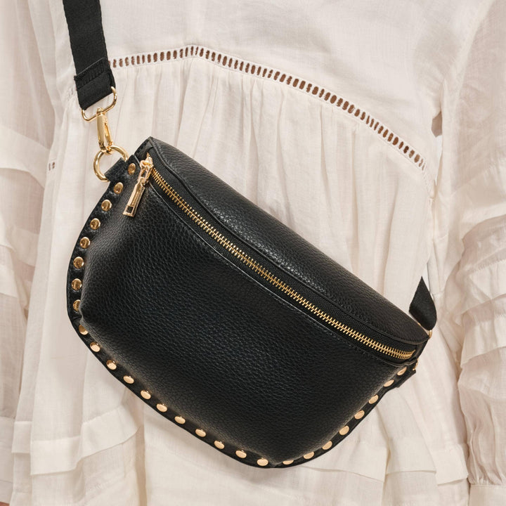 Black leather gizelle belt bag with gold-tone studs and zipper for stylish hands-free use