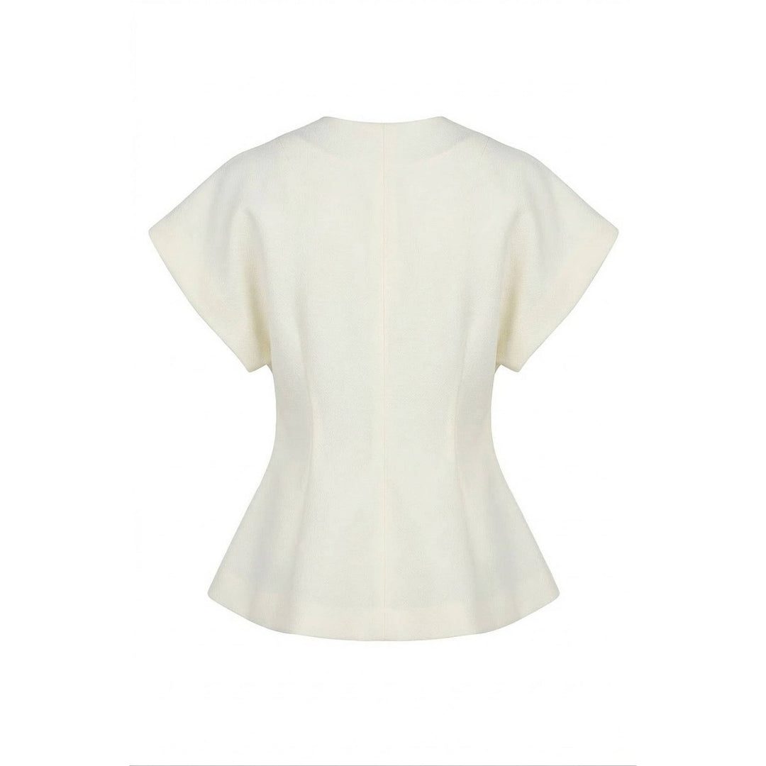 Cream-colored textured wrap top with peplum hem short flared sleeves and fitted bodice for stylish wear