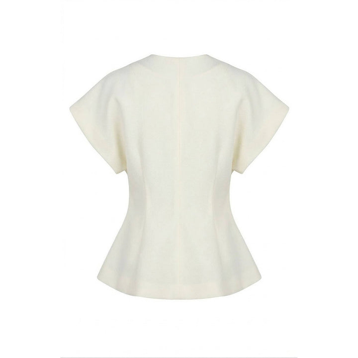 Cream-colored textured wrap top with peplum hem short flared sleeves and fitted bodice for stylish wear