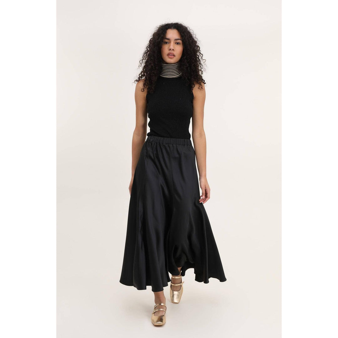 Valentina black skirt made of black satin with a high-waisted elastic waistband and an asymmetrical hemline