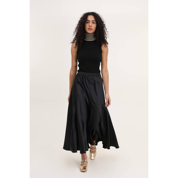 Valentina black skirt made of black satin with a high-waisted elastic waistband and an asymmetrical hemline