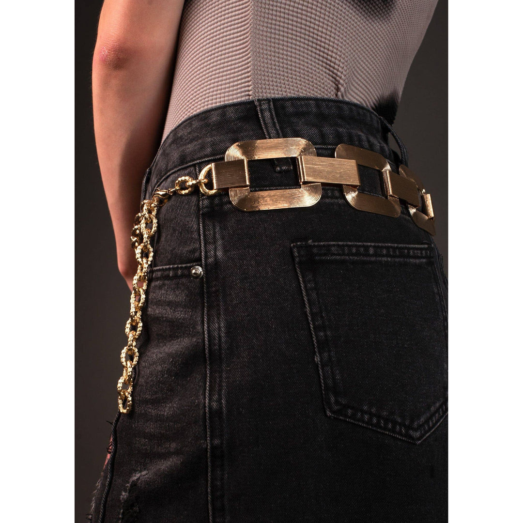 Large link chain belt with gold-toned rectangular brushed metal links and a dangling gold chain detail