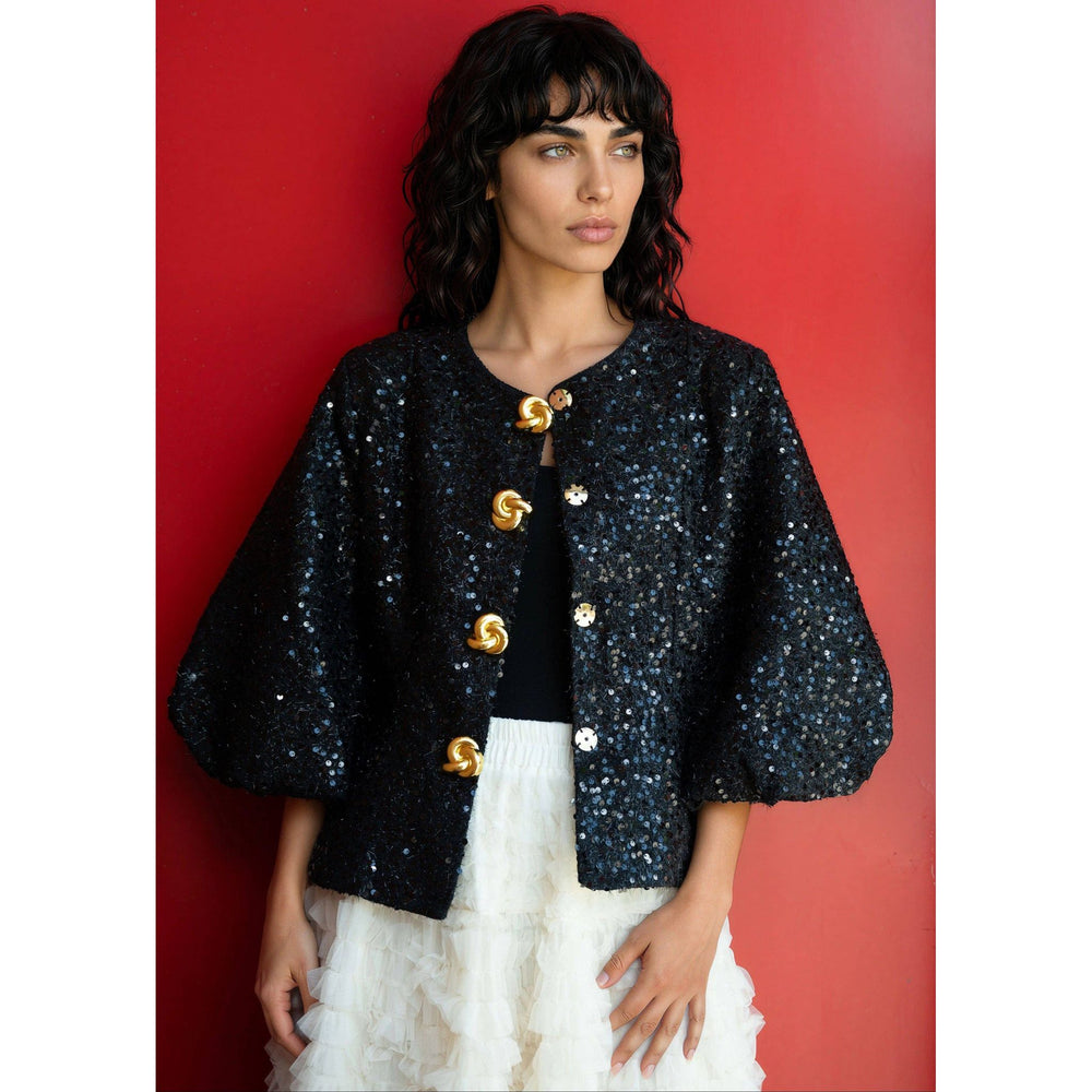 Black sequined tinsel balloon sleeve jacket with cape style and gold tone twisted button closures