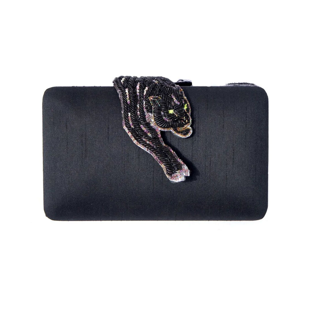 Black satin panther clutch with intricately beaded appliqué and glowing yellow eyes for elegant evening use