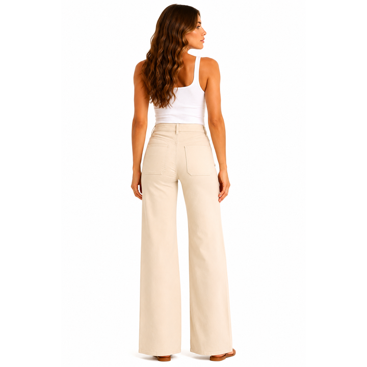 Beige high-waisted wide-leg trousers with a tailored fit and back pockets shown from the back in luxe wide leg cream patch pocket pants