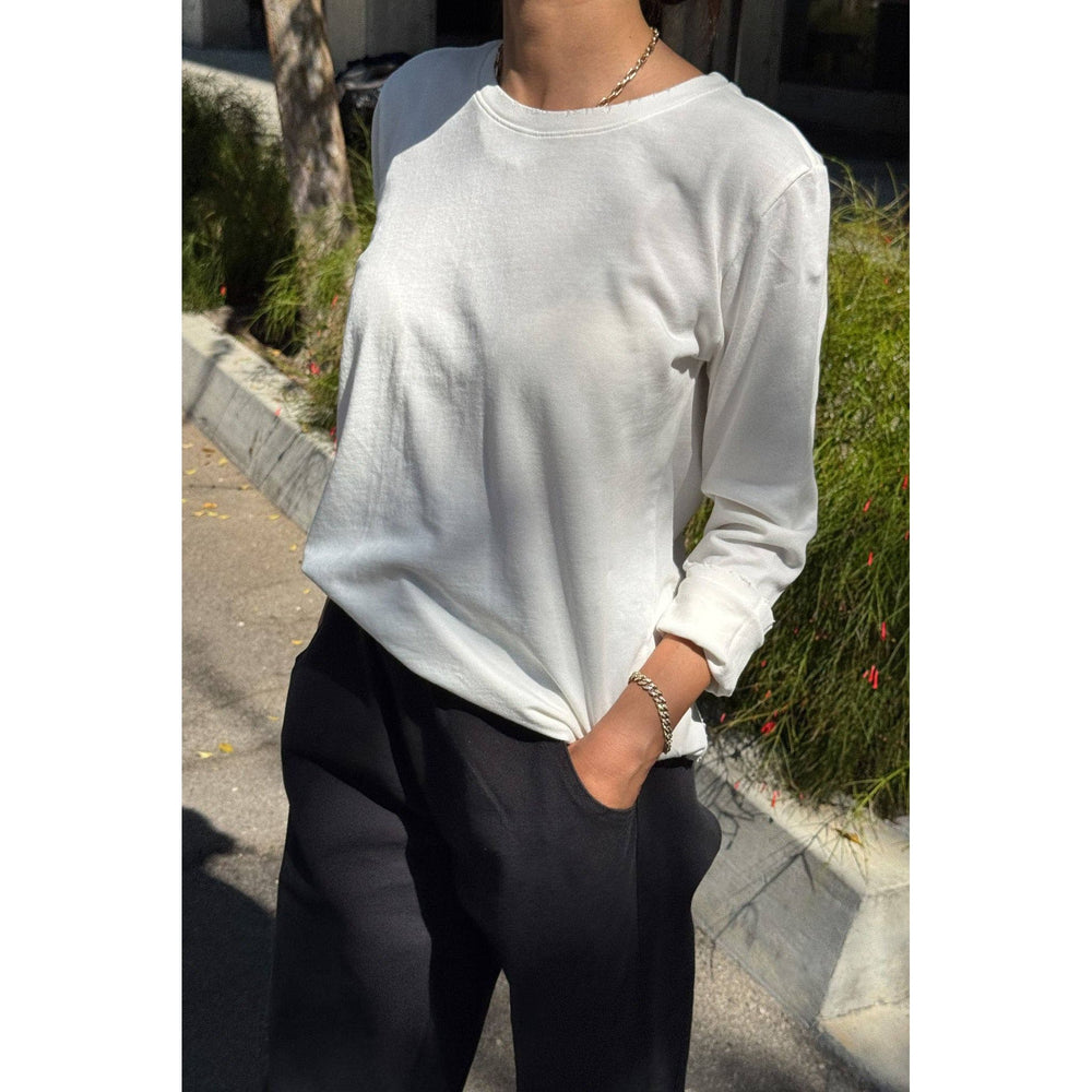 White long-sleeved cotton everyday tee with rolled cuffs for casual wear