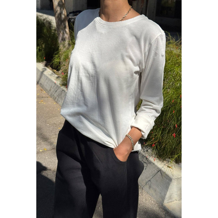 White long-sleeved cotton everyday tee with rolled cuffs for casual wear