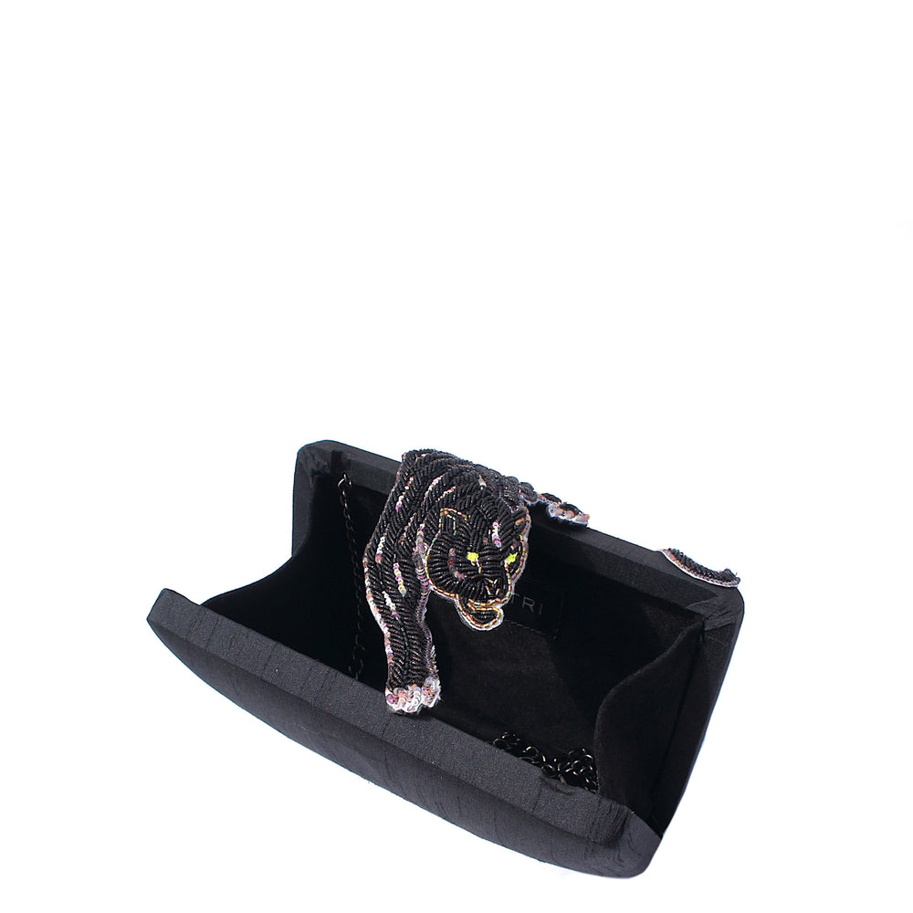 Black beaded panther clutch with glowing green eyes and silver accents ideal for evening wear