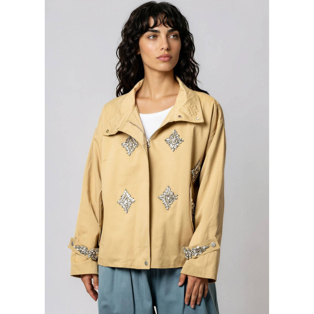 Beige crystal embellished utility jacket with silver crystals on front and cuffs for stylish outerwear look