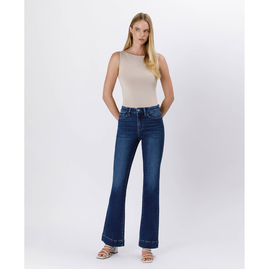 High rise trouser denim in dark blue high-waisted flare jeans with classic five-pocket design and rolled cuffs