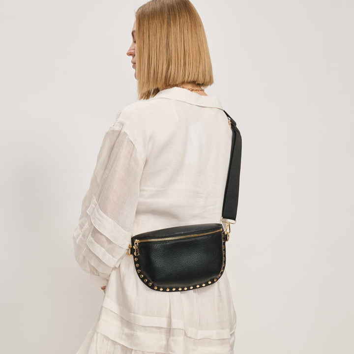 Black gizelle belt bag with textured leather, gold-tone studs, and zipper crossbody design
