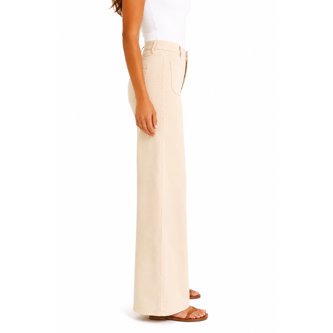 Cream-colored wide-leg tailored trousers with subtle front patch pockets for a sleek luxe look