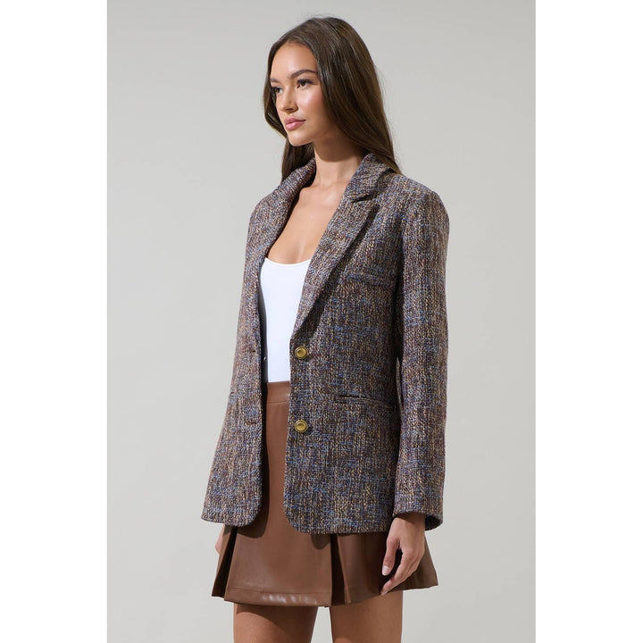 Tweed oversized blazer in a muted brown and gray blend with textured fabric and gold-toned buttons