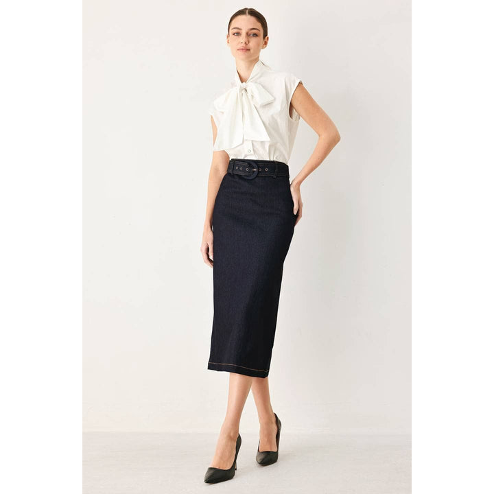 Navy blue denim pencil skirt with black belt paired with white blouse showcasing a chic office outfit