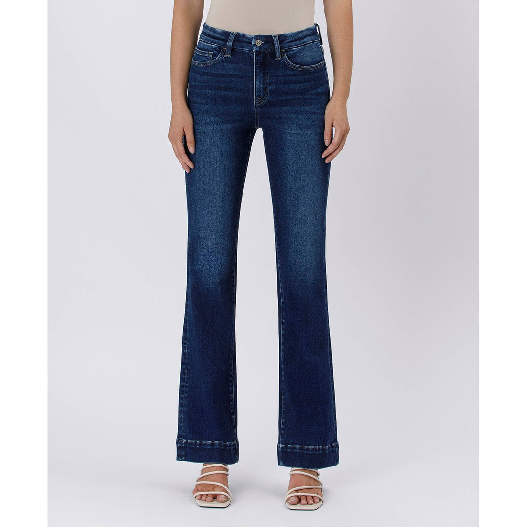 Dark blue high rise trouser denim jeans with flared legs classic five-pocket design and rolled cuffs