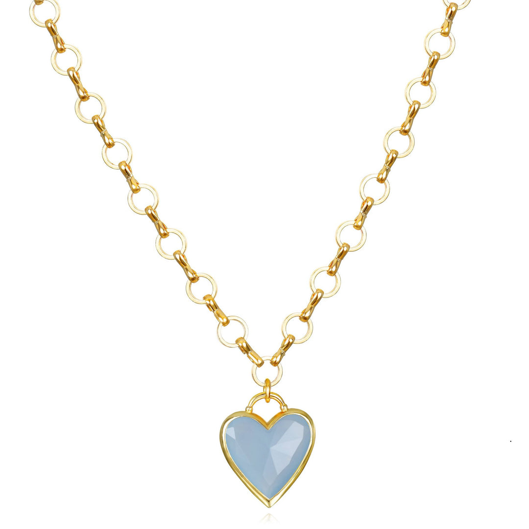 A delicate gold-toned chain necklace with a heart-shaped blue jade pendant in a matching gold-tone frame