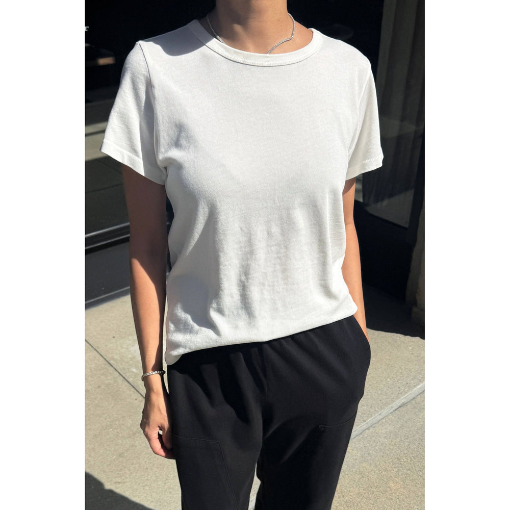 White short-sleeved crew neck premium tee with soft textured fabric and subtle ribbed neckline for everyday wear