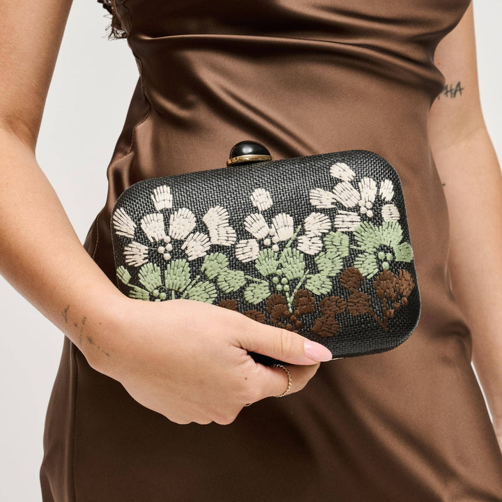 Roley evening bag black woven clutch with intricate white green brown embroidered floral design and glossy clasp