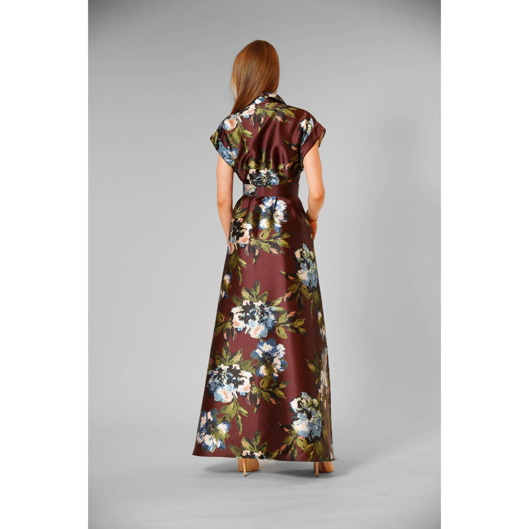 The Pearl Pagoda Luxe Chocolate Floral Gown featuring a vibrant blue and green floral print on structured twill fabric
