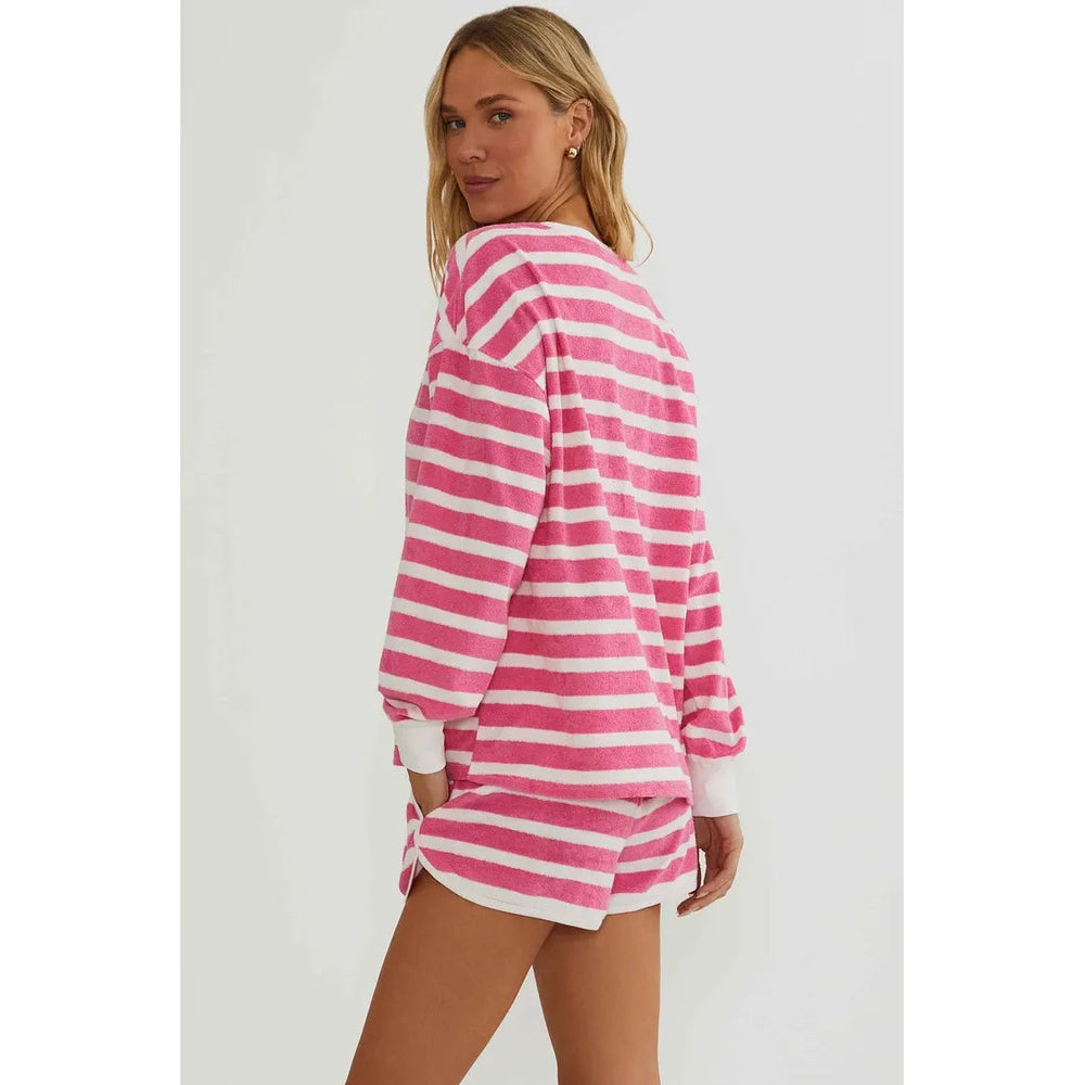 The Pearl Pagoda Fia shorts in pink and white misty stripe terry cloth with an elastic waistband and side pockets.