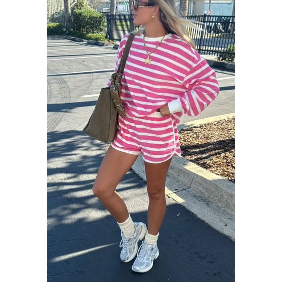 The Pearl Pagoda Fia shorts in pink and white misty stripe terry cloth with an elastic waistband and side pockets.