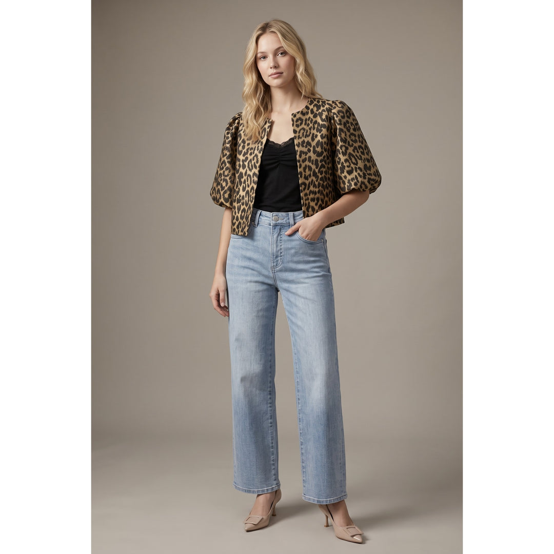 The Pearl Pagoda leopard print cropped jacket with balloon sleeves worn by a model with jeans and heels.