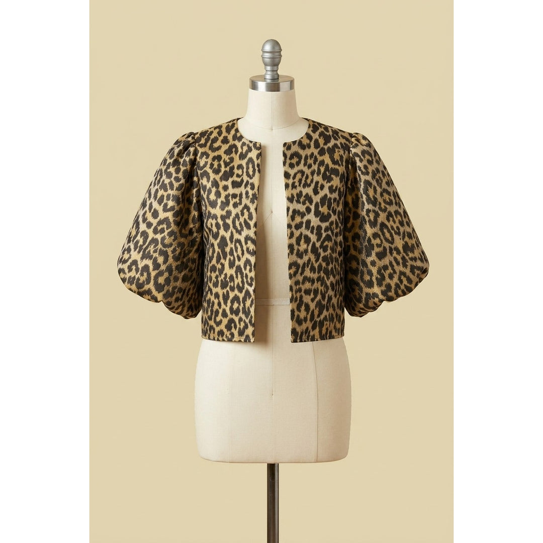 The Pearl Pagoda leopard print cropped jacket with balloon sleeves and a collarless neckline on a mannequin.