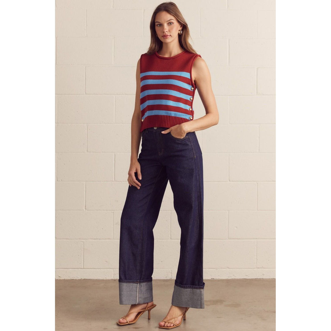 The Pearl Pagoda burgundy and powder-blue striped cotton sweater vest with gold-tone side buttons on a model.