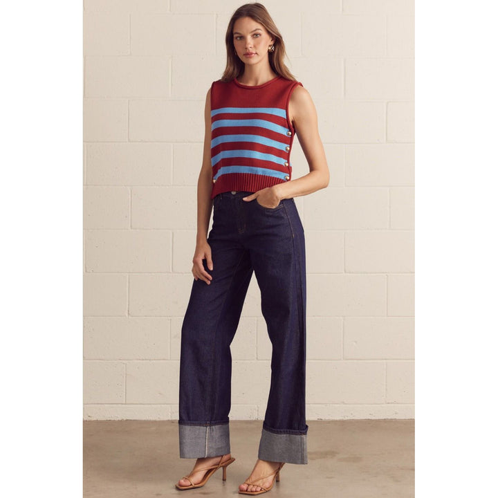 The Pearl Pagoda burgundy and powder-blue striped cotton sweater vest with gold-tone side buttons on a model.