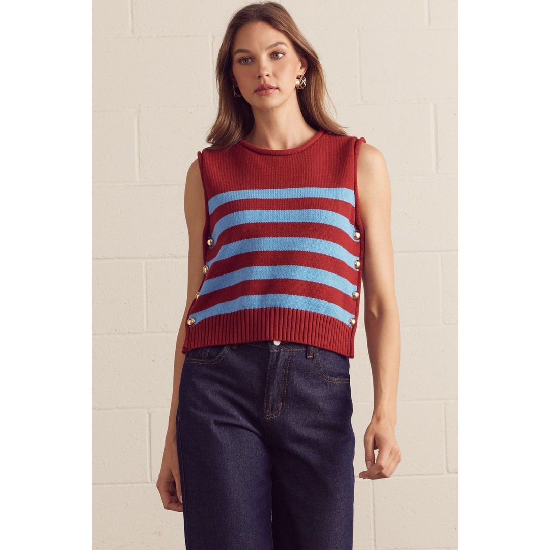 The Pearl Pagoda burgundy and powder-blue striped cotton sweater vest with gold-tone side buttons on a model