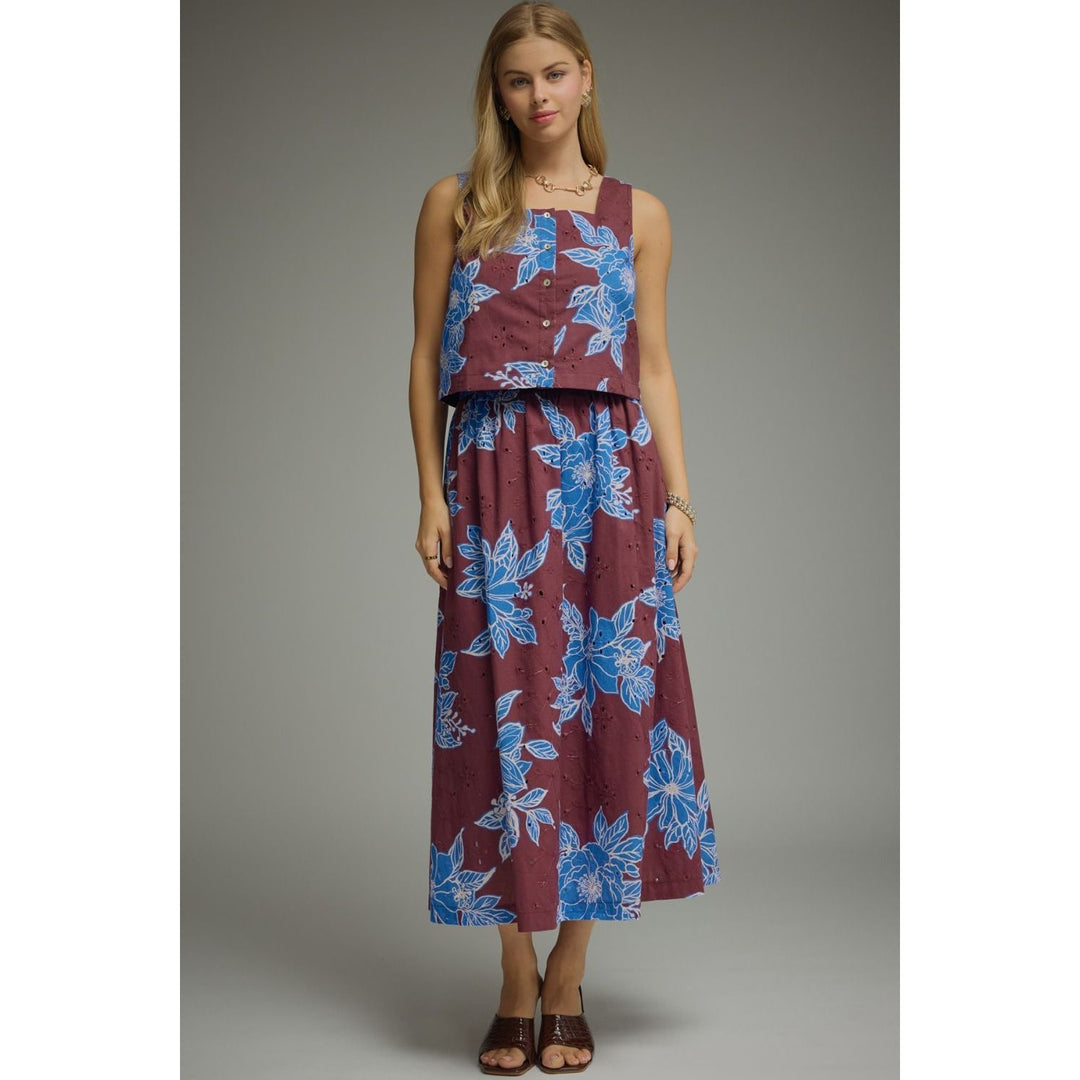 Model wearing The Pearl Pagoda Bordeaux Blooms midi skirt in wine cotton eyelet with blue floral embroidery